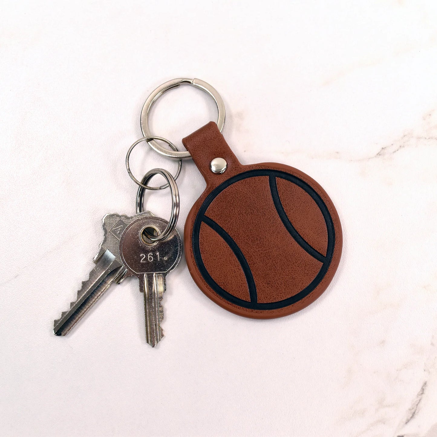 Racquet Inc Leather Tennis Ball Keychain